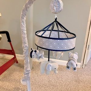 Attachable navy blue and white carousel with baby jungle animals